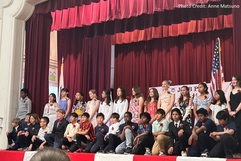 Graduating student accepts certificate