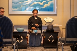 Consul General Osumi prepares a bowl of tea